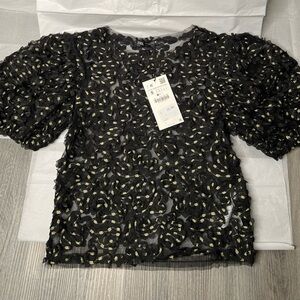 Never worn before back mesh blouse with gold accents! Tag still attached